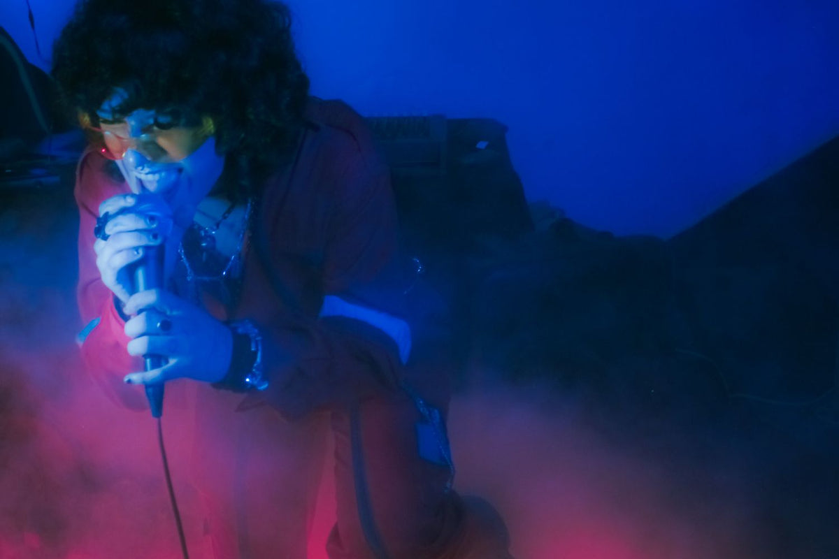 R&B singer performing with a microphone