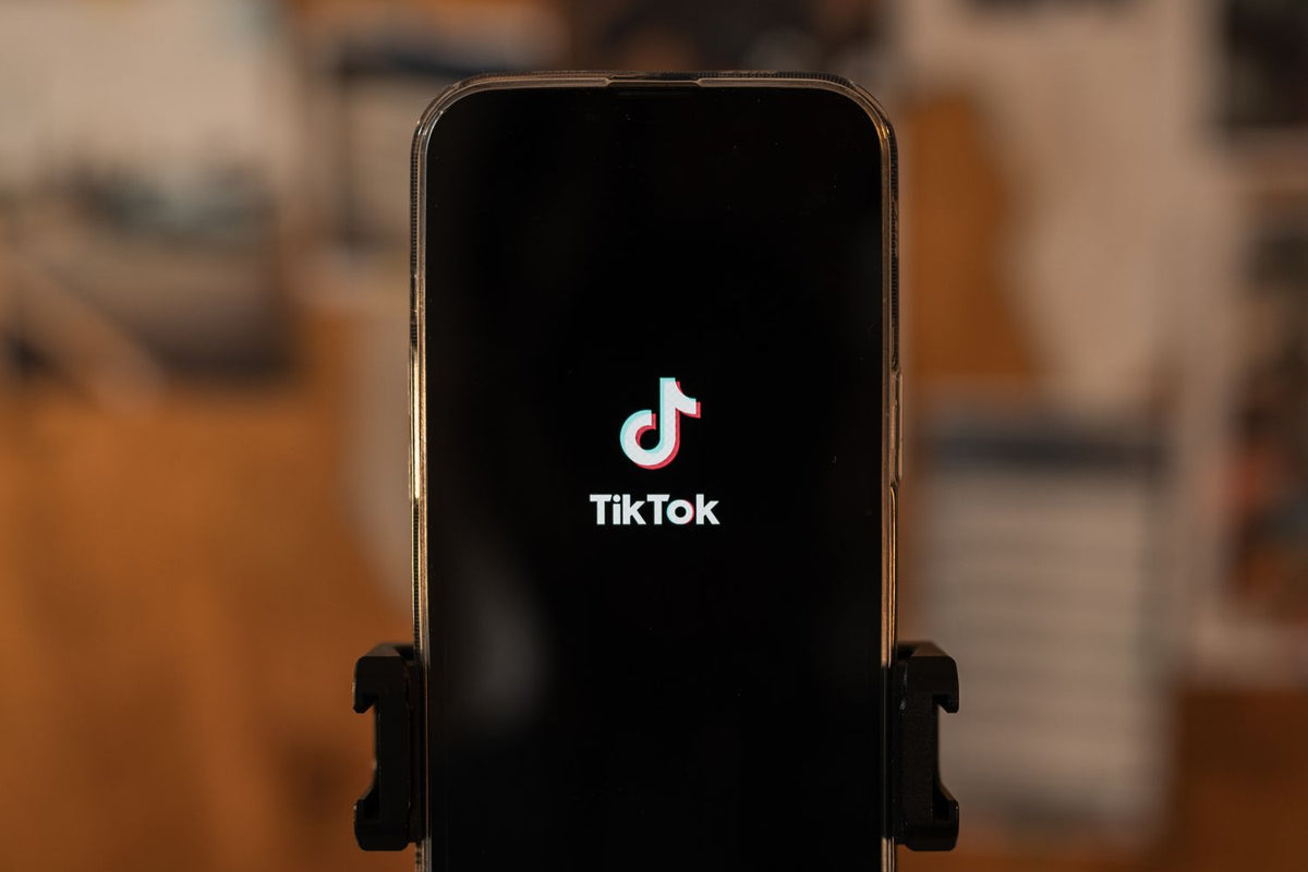 Artist filming a short video on a phone for TikTok