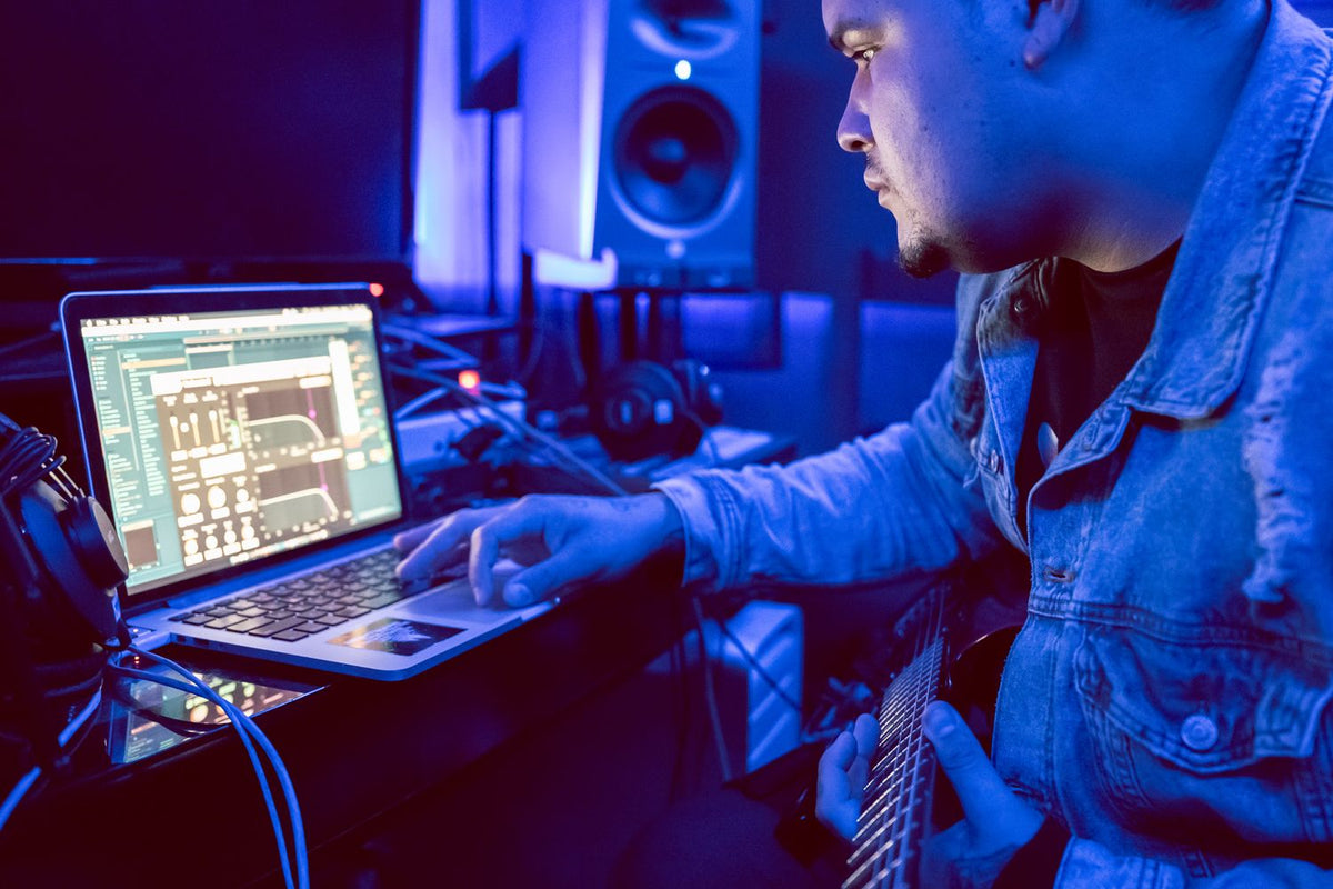 Producer comparing beat marketplaces on a laptop