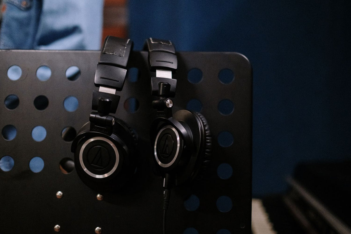 Artist listening to beats with studio headphones