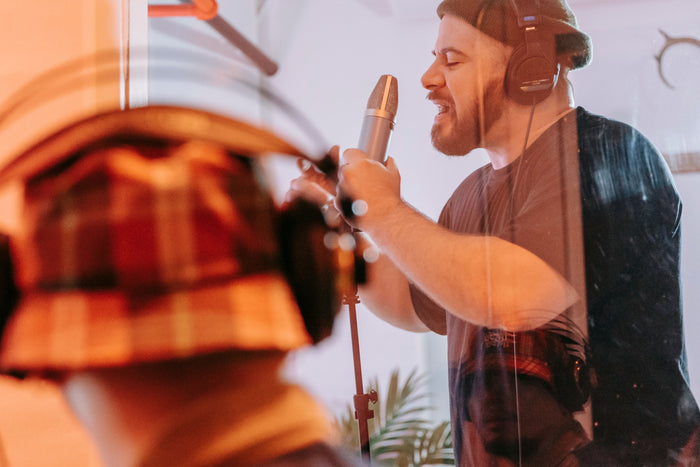 Producer at studio mixing board building artist and fan relationships