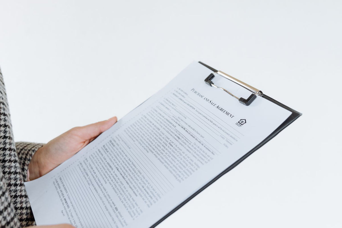 Checklist and paperwork laid out on a desk