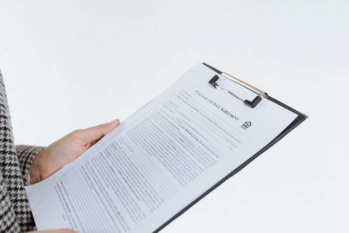 Checklist and paperwork laid out on a desk
